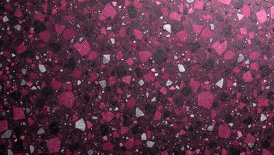 The primary subject of the image is a close-up of a purple and pink marbled surface. The setting is a patterned surface, possibly a wall or a countertop. The visual style appears to be a close-up of a textured surface, possibly a marbled or patterned material. The colors and mood of the image are predominantly purple and pink, creating a warm and inviting atmosphere.