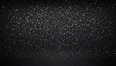 The primary subject of the image is a night sky filled with bright, shining stars. The setting is a dark background, which contrasts with the bright stars. The visual style is a black and white photo, giving the image a classic and timeless feel. The colors and mood of the image are predominantly dark and moody, with the bright stars providing a touch of light and beauty.