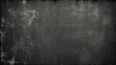 The primary subject of the image is a gray, textured surface. The setting is a black and white photo, giving it a vintage or artistic appearance. The visual style is a combination of a photo and a drawing, creating a unique and intriguing image. The colors and mood are predominantly gray, with a slightly moody atmosphere.