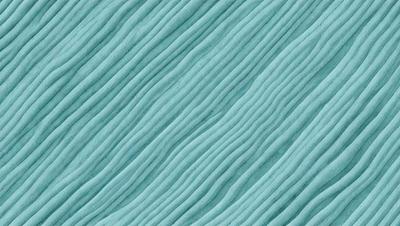 The primary subject of the image is a blue, wavy fabric. The setting is a blue background, and the visual style appears to be a pattern or texture. The dominant colors are blue and white, creating a calm and soothing atmosphere.