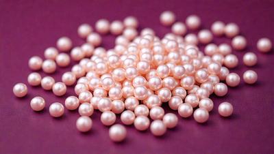 The primary subject of the image is a pile of pink pearls. The pearls are arranged in a circular pattern, creating a visually appealing display. The setting is a purple surface, which provides a contrasting background for the pearls. The visual style of the image is a close-up of the pearls, showcasing their details and texture. The colors and mood of the image are predominantly pink, giving it a warm and elegant atmosphere.