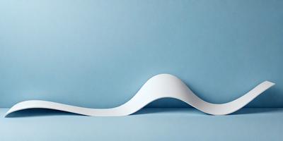 The primary subject of the image is a white paper or cardboard, which is placed on a blue surface. The setting appears to be a room or a workspace, as the paper is sitting on a table. The visual style of the image is a combination of a photo and a drawing, giving it a unique and artistic appearance. The colors in the image are predominantly blue and white, creating a calm and soothing atmosphere.