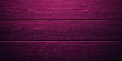 The primary subject of the image is a wooden wall with a purple color. The setting is a room with a wooden floor. The visual style is a close-up of the wooden wall, showcasing its texture and color. The dominant colors are purple and brown, creating a warm and inviting atmosphere.