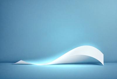 The primary subject of the image is a white paper or a piece of paper with a wave-like design on it. The paper is lying on a blue surface, which could be a table or a wall. The visual style of the image is a combination of a photo and a digital art, as it appears to be a close-up of the paper with a wave-like design. The colors and mood of the image are predominantly blue, with the white paper contrasting against the blue surface.