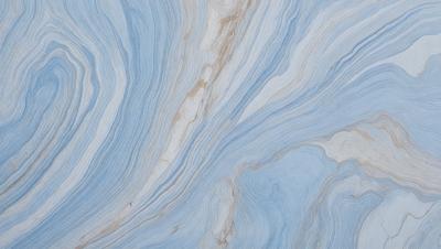 The primary subject of the image is a blue and white marbled surface, which appears to be a marble tile or a marble-like material. The setting is a room with a blue and white marbled wall, which adds a unique and elegant touch to the space. The visual style of the image is a close-up of the marbled surface, showcasing its intricate patterns and textures. The colors and mood of the image are predominantly blue and white, creating a serene and sophisticated atmosphere