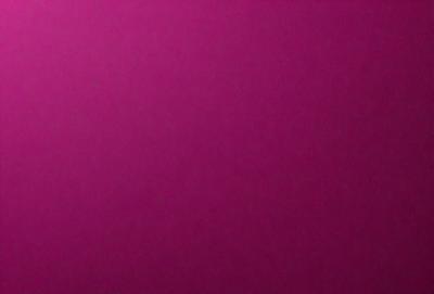 The primary subject of the image is a large, pink wall. The setting is a room with a pink background, and the visual style is a close-up of the wall. The dominant colors in the image are pink, and the overall atmosphere is warm and inviting.