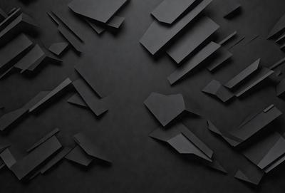The primary subject of the image is a black and white photo of a wall with a pattern of cut outs. The setting is a dark room, and the visual style is a close-up of the wall. The colors and mood of the image are predominantly black and white, creating a dramatic and artistic atmosphere.
