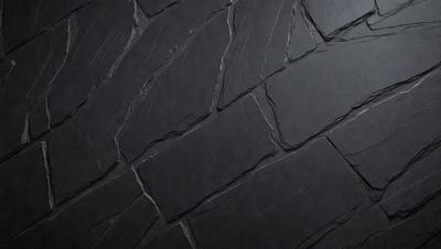 The primary subject of the image is a black brick wall. The setting is a dark room, and the visual style is a close-up of the brick wall. The colors and mood of the image are predominantly dark and moody, with the black brick wall being the main focus.