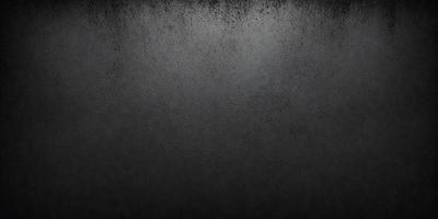 The primary subject of the image is a black and white photo of a wall. The setting is a dark room, and the visual style is a close-up of the wall. The colors and mood of the image are predominantly dark and moody, with the black and white color scheme adding to the atmosphere.