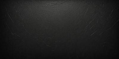 The primary subject of the image is a black leather surface. The setting is a black background, and the visual style is a close-up of the leather surface. The colors and mood of the image are predominantly dark and moody, with the black leather creating a dramatic and intense atmosphere.