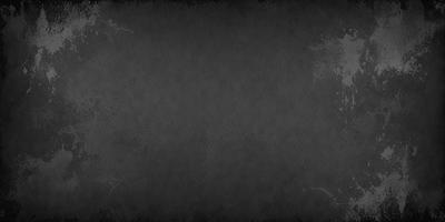 The primary subject of the image is a large, empty, and dark space. The setting is a black background, which creates a dramatic and moody atmosphere. The visual style is a black and white photo, which adds a sense of depth and contrast to the scene. The colors and mood of the image are predominantly dark and mysterious, with the black background and the lack of any other objects or elements in the space contributing to this mood.