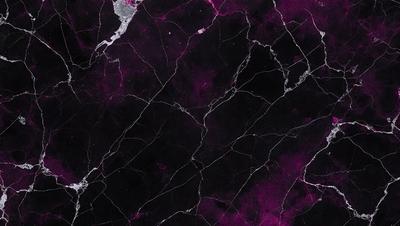 The primary subject of the image is a marble-like surface with a purple hue. The setting is a black background, which contrasts with the purple marble. The visual style is a close-up of the marble, showcasing its texture and color. The colors and mood of the image are predominantly purple, creating a unique and striking appearance.