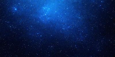 The primary subject of the image is the night sky filled with stars. The setting is a dark, star-filled sky, and the visual style is a photo of the night sky. The colors and mood of the image are predominantly dark and serene, with the stars providing a sense of wonder and tranquility.