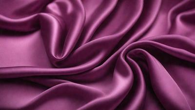 The primary subject of the image is a purple fabric, which is the main object, scene, or focus of the image. The setting or background is a purple fabric, and the visual style is a photo. The colors and mood of the image are predominantly purple, creating a calm and soothing atmosphere.