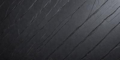 The primary subject of the image is a close-up of a black leather surface. The setting is a dark room, and the visual style appears to be a photo. The dominant colors are black and grey, creating a moody atmosphere.