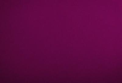 The primary subject of the image is a purple wall. The setting is a room with a purple background. The visual style is a close-up of the purple wall. The colors and mood of the image are predominantly purple, creating a calm and serene atmosphere.