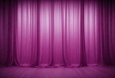 The primary subject of the image is a purple curtain, which is the main object and scene of the image. The setting is a stage or theater, with the curtains hanging down. The visual style is a photo, capturing the purple curtains in their natural environment. The colors and mood of the image are predominantly purple, creating a dramatic and theatrical atmosphere.