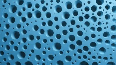 The primary subject of the image is a blue wall with a pattern of round holes. The setting is a room with a blue background, and the visual style appears to be a combination of a photo and a digital art or illustration. The dominant colors are blue and white, creating a calm and soothing atmosphere.