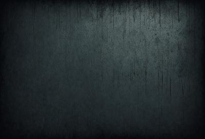 The primary subject of the image is a blue wall with a textured surface. The setting is a room with a blue wall, and the visual style is a photo. The dominant colors are blue and gray, creating a calm and serene atmosphere.