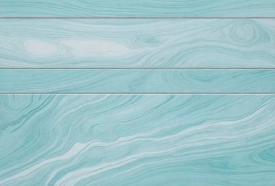 The primary subject of the image is a blue and white marbled wall. The setting is a room with a blue and white marbled wall, which serves as the background. The visual style is a photo, capturing the intricate patterns and textures of the marbled wall. The dominant colors are blue and white, creating a calm and soothing atmosphere.