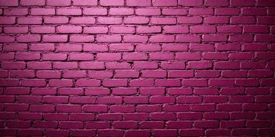 The primary subject of the image is a brick wall painted in a pink hue. The setting is a brick wall, and the visual style is a photo. The dominant colors are pink and red, creating a warm and inviting atmosphere.