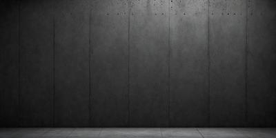 The primary subject of the image is a large gray wall. The setting is a dark room, and the visual style is a photo. The dominant colors are gray, and the overall atmosphere is moody and dramatic.