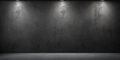 The primary subject of the image is a large, grey wall with a dull, dirty appearance. The setting is a room with a concrete floor. The visual style is a black and white photo, which adds a sense of depth and contrast to the scene. The colors and mood of the image are predominantly dark and moody, with the grey wall and concrete floor contributing to the overall atmosphere.