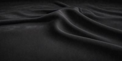 The primary subject of the image is a black surface, which appears to be a piece of fabric or a black background. The setting or background is a dark room, and the visual style is a close-up of the fabric or background. The colors and mood of the image are predominantly dark and moody, with the black surface being the main focus.