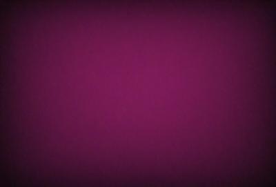 The primary subject of the image is a purple background. The setting is a dark, purple room, and the visual style is a close-up of the purple wall. The colors and mood of the image are predominantly purple, creating a calm and serene atmosphere.