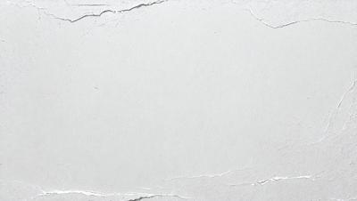 The primary subject of the image is a white wall with a large, empty space on it. The setting is a room with a white wall, and the visual style is a photo. The colors and mood of the image are predominantly white, giving it a clean and minimalist appearance.