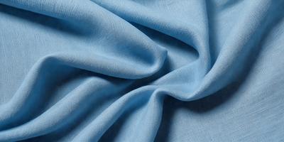 The primary subject of the image is a blue fabric, which is the main object, scene, or focus of the image. The setting or background is a blue cloth, and the visual style is a photo. The dominant colors and overall atmosphere are blue and calm.