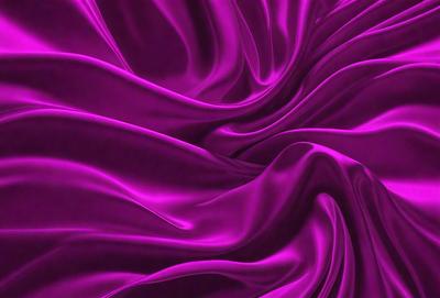 The primary subject of the image is a purple fabric, which is the main object, scene, or focus of the image. The setting or background is a purple curtain, and the visual style is a photo. The colors and mood of the image are predominantly purple, creating a calm and serene atmosphere.