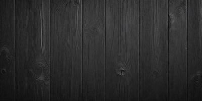 The primary subject of the image is a wooden wall with a black surface. The setting is a room with a wooden floor. The visual style is a black and white photo. The dominant colors are black and white, creating a classic and timeless atmosphere.