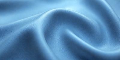 The primary subject of the image is a blue piece of fabric, possibly a leather material. The setting is a blue background, which creates a contrast with the fabric. The visual style appears to be a close-up of the fabric, showcasing its texture and details. The colors and mood of the image are predominantly blue, giving it a calm and serene atmosphere.