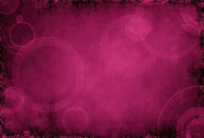 The primary subject of the image is a pink background with a pattern of circles. The setting is a room with a pink wall, and the visual style is a combination of a photo and a pattern. The dominant colors are pink and white, creating a warm and inviting atmosphere.