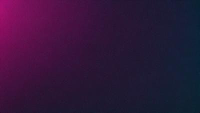 The primary subject of the image is a purple background. The setting is a dark, purple room with a pink hue. The visual style is a close-up of the purple background, which creates a moody and dramatic atmosphere.