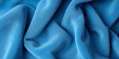 The primary subject of the image is a blue fabric, which is the main object, scene, or focus of the image. The setting or background is a blue cloth, and the visual style is a photo. The dominant colors and overall atmosphere are blue and serene.