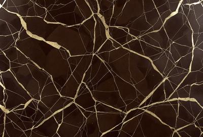 The primary subject of the image is a close-up of a marble surface with a gold-like pattern. The setting is a dark room, and the visual style appears to be a photo. The dominant colors are brown and gold, creating a warm and luxurious atmosphere.