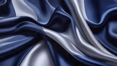 The primary subject of the image is a blue fabric, possibly a piece of silk, with a silver or metallic sheen. The setting is a close-up of the fabric, showcasing its texture and pattern. The visual style is a combination of digital art and illustration, creating a realistic yet artistic representation of the fabric. The colors and mood of the image are predominantly blue and silver, giving it a sleek and modern appearance.