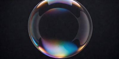 The primary subject of the image is a large, colorful bubble floating in a dark, empty space. The bubble is filled with a variety of colors, creating a vibrant and lively atmosphere. The visual style of the image is a close-up of the bubble, showcasing its intricate details and textures. The setting or background of the image is a black surface, which contrasts with the bright and colorful bubble, emphasizing its presence in the scene.