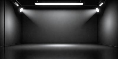 The primary subject of the image is a black wall with a light shining on it. The setting is a dark room, and the visual style is a black and white photo. The dominant colors are black and white, and the overall atmosphere is moody and dramatic.