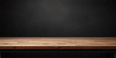 The primary subject of the image is a wooden table. The setting is a black background, which creates a contrast with the wooden table. The visual style is a photo, capturing the wooden table in detail. The colors and mood of the image are predominantly dark, with the wooden table being the main focal point.