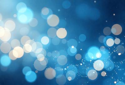 The primary subject of the image is a blue background with a pattern of white lights or sparkles. The setting appears to be a dark room, and the visual style is a combination of a photo and digital art. The dominant colors are blue and white, creating a calm and serene atmosphere.