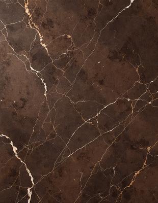The image features a brown marble wall with a pattern of white veins. The wall appears to be made of stone, giving it a natural and textured appearance. The primary subject of the image is the marble wall, which serves as the main focus of the scene. The setting is indoors, likely in a room with a stone or marble theme. The visual style of the image is a close-up of the marble wall, showcasing its unique texture and pattern. The colors and mood of the image are