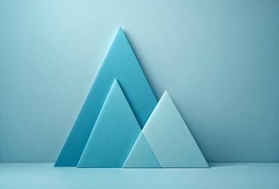 The primary subject of the image is a blue triangle, which is the main object, scene, or focus of the image. The setting or background is a blue surface, which provides a contrasting and complementary color to the triangle. The visual style of the image is a digital art or illustration, as it is a well-crafted and detailed representation of the blue triangle. The colors and mood of the image are predominantly blue, creating a calm and serene atmosphere.
