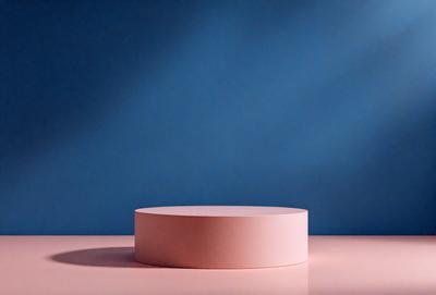 The primary subject of the image is a pink, round object, which is placed on a pink surface. The setting is a blue background, which creates a contrasting and visually appealing scene. The visual style of the image is a photo, capturing the details and colors of the pink object and the pink surface. The colors and mood of the image are predominantly pink, creating a warm and inviting atmosphere.