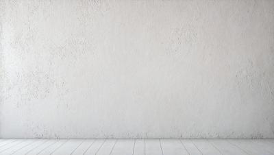 The primary subject of the image is a white wall. The setting is a room with a white floor. The visual style is a photo, and the colors and mood are predominantly white, giving the image a clean and minimalist appearance.
