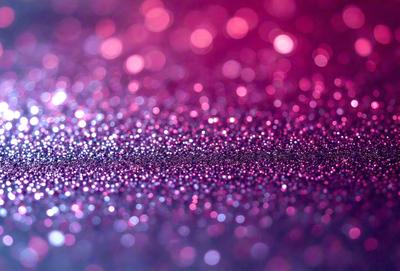 The primary subject of the image is a close-up of a pink background with a pattern of glittering, shiny, and sparkling pink dots. The setting appears to be a pink surface, possibly a wall or a piece of fabric. The visual style of the image is a close-up of the pink background, which creates a sense of depth and focus on the pink dots. The colors and mood of the image are predominantly pink, creating a warm and inviting atmosphere.