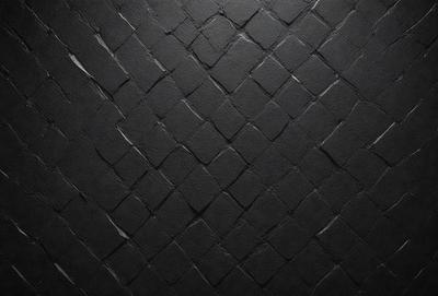 The primary subject of the image is a black leather material, which appears to be a leather wall or a leather-like surface. The setting is a dark room, and the visual style is a close-up of the leather material. The colors and mood of the image are predominantly dark and moody, with the black leather material being the main focus.