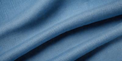 The primary subject of the image is a blue fabric, which is the main object, scene, or focus of the image. The setting or background is a blue cloth, and the visual style is a photo. The dominant colors and overall atmosphere are blue and calm.